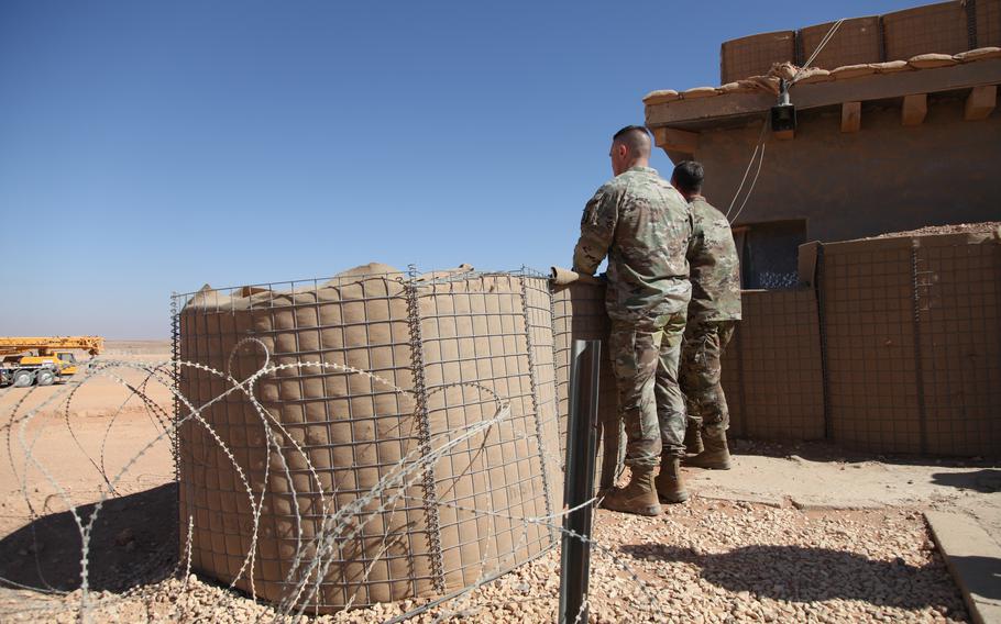 Gen. Michael Erik Kurilla, commander of U.S. Central Command, and Lt. Col. Ian Ginty surveying the garrison from an outlook.