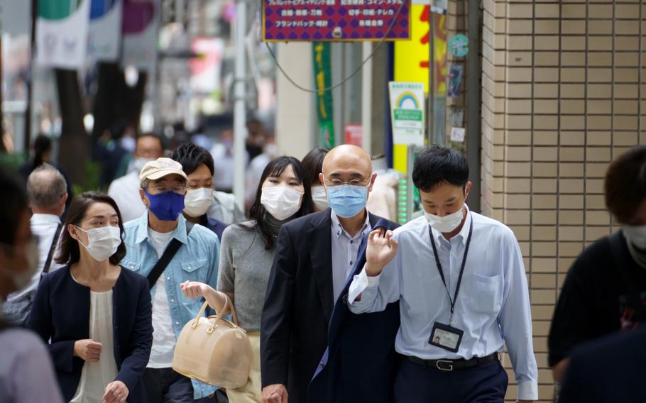 Pedestrians in central Tokyo continued wearing masks while the city remained under a coronavirus emergency on Sept. 8, 2021.