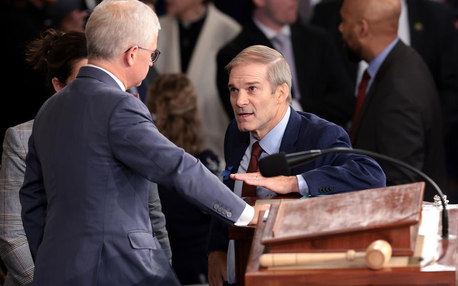 U.S. Rep. Jim Jordan (R-Ohio), right, talks to Speaker Pro Tempore Rep. Patrick McHenry (R-N.C.) as the House of Representatives prepares to hold a vote on a new speaker of the House at the U.S. Capitol on Wednesday, Oct. 18, 2023, in Washington.