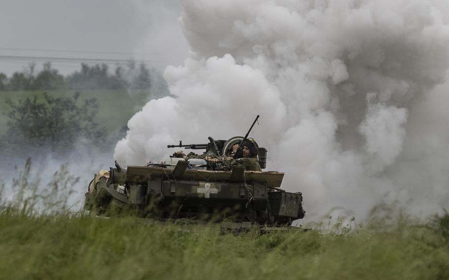 Ukrainian soldiers in a Soviet-era tank during practice maneuvers in the Zaporizhzhia region on May 24.