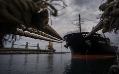 A ship carrying grain waits in port in Odessa, Ukraine. The country's agricultural and mineral riches have been put at risk by the Russian invasion. MUST CREDIT: Photo for The Washington Post by Wojciech Grzedzinski.