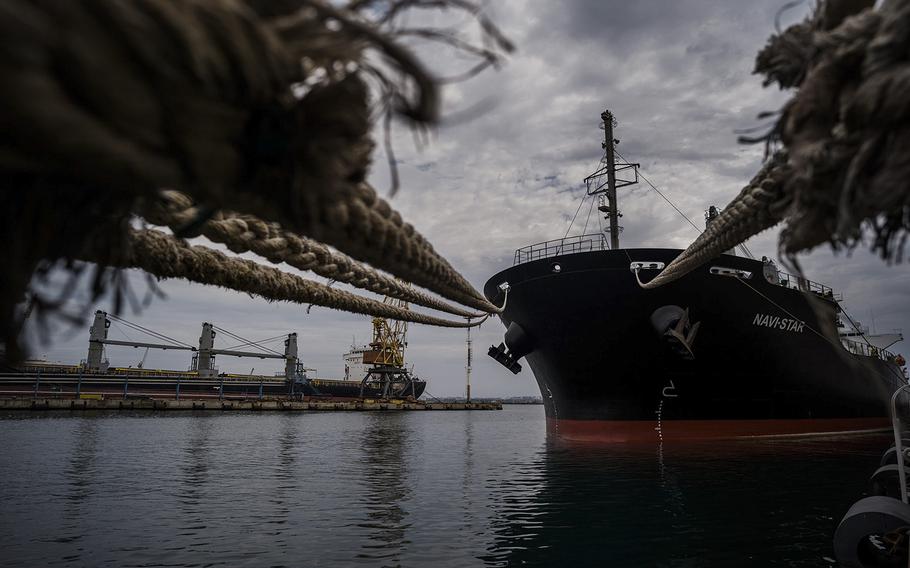 A ship carrying grain waits in port in Odessa, Ukraine. The country’s agricultural and mineral riches have been put at risk by the Russian invasion. 