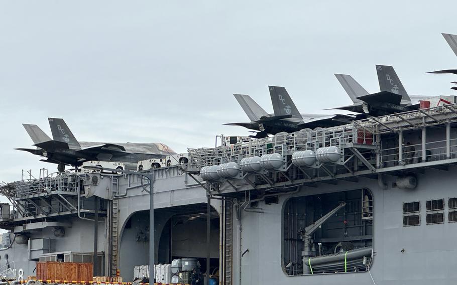 Marine Corps F-35B Lightning II stealth fighters park on the flight deck of the amphibious assault ship USS Makin Island in Busan, South Korea, Thursday, March 23, 2023.