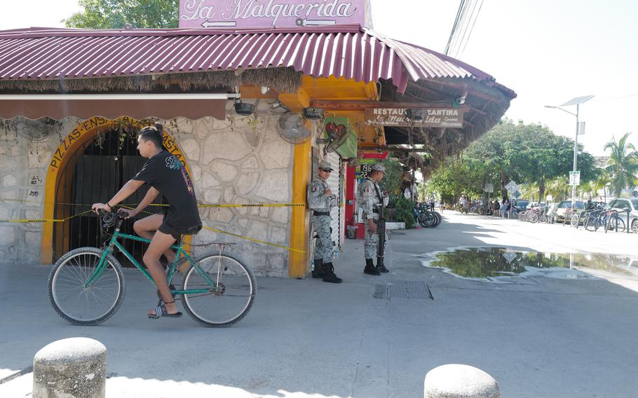 Security forces stand outside the Malquerida bar in Tulum, where two tourists were killed in October. 
