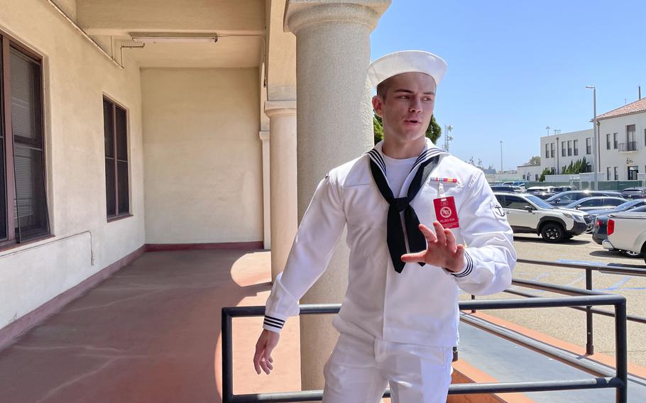 U.S. Navy sailor Ryan Sawyer Mays walks past reporters at Naval Base San Diego before entering a Navy courtroom Wednesday, Aug. 17, 2022.