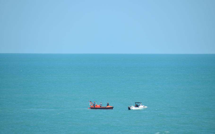 A fast rescue boat from the USNS Millinocket lends a hand to sailors in distress near Darwin, Australia, Aug. 8, 2023.