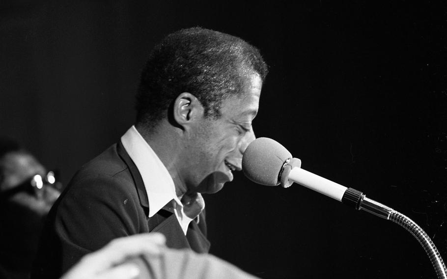 Author James Baldwin smiles during “Black Literature Night” and “Discussion of the Racial Situation in America and Europe” at the Liederhalle in Stuttgart. 