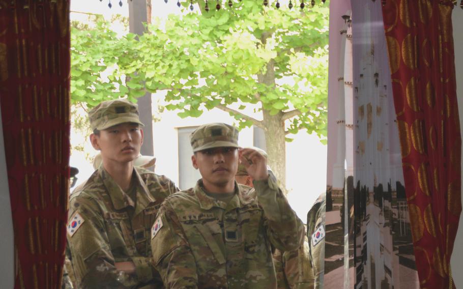 U.S. and South Korean soldiers wait in line at the Provider Grill dining facility as celebrity chef Baek Jong-won films an episode of “Backpacker” at Camp Humphreys, South Korea, June 28, 2022. 