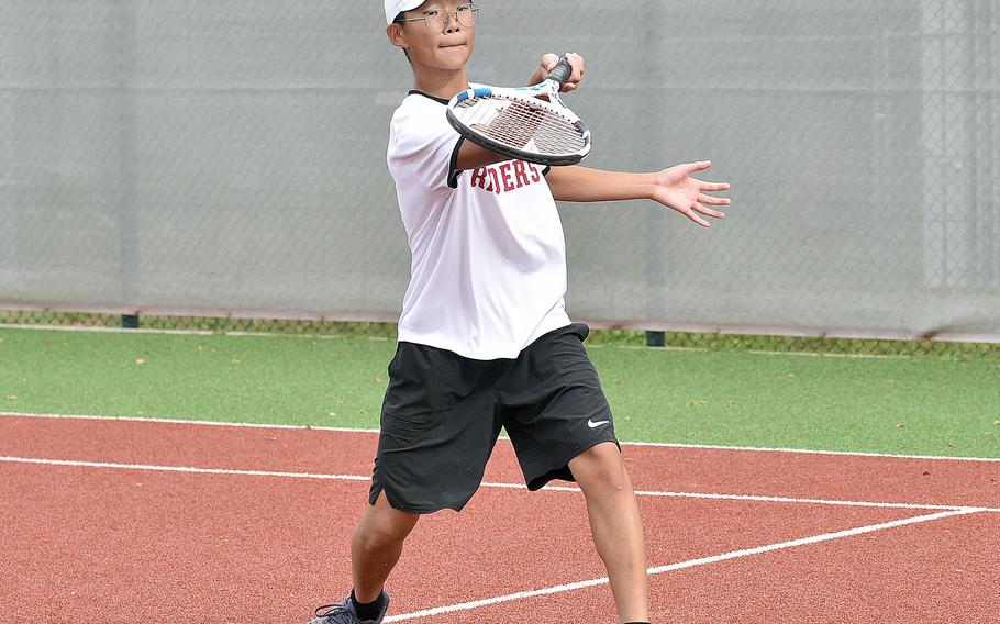 Raider Bryan Oh lifts a looping shot during a singles match on Sept. 23, 2023, at Kaiserslautern High School in Kaiserslautern, Germany.