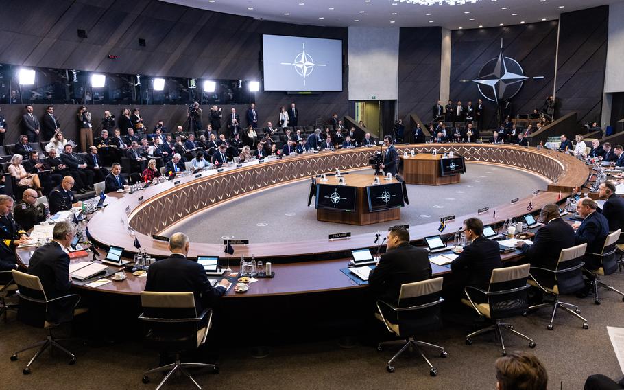 NATO country defense ministers, including U.S. Defense Secretary Lloyd Austin, meet in Brussels on Feb. 15, 2023. The alliance will put renewed emphasis on pressuring member countries to devote a greater share of their budgets to defense.