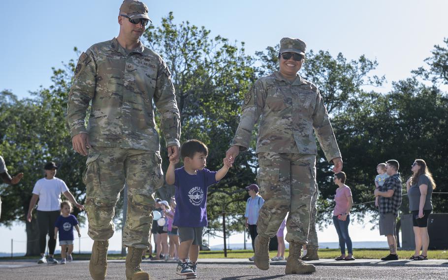 Military families participate in the Month of the Military Child Parade at MacDill Air Force Base, Fla., April 12, 2024. The parade was held to honor and celebrate military children. There are more than 1.6 million children serving alongside service members, who move on average every two to three years.