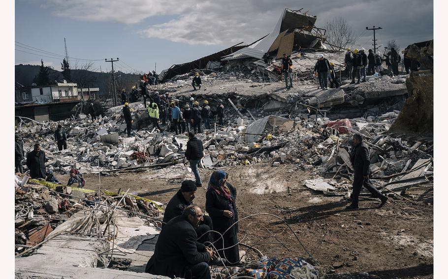 Rescuers search through the rubble in Nurdagi, Turkey, on Feb. 7, 2023.