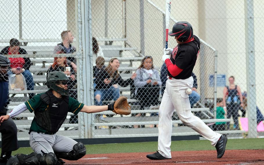 Nile C. Kinnick’s Robert Lee gets hit by an errant pitch in the bottom of the first inning against Robert D. Edgren during Saturday’s DODEA-Japan baseball game. The Red Devils won 8-1.