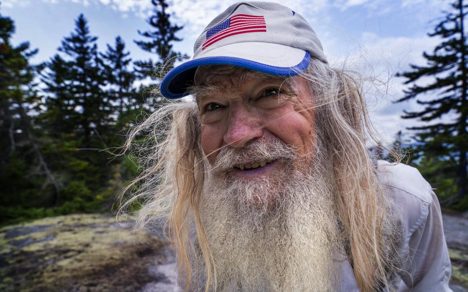 M.J. Eberhart, 83, arrives on the summit of Mount Hayes on the Appalachian Trail, Sunday, Sept. 12, 2021, in Gorham, N.H. Eberhart, who goes by the trail name of Nimblewill Nomad, is the oldest person to hike the entire 2,193-mile Appalachian Trail.