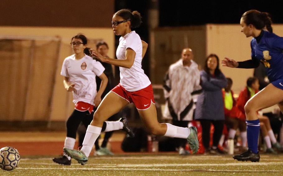 Nile C. Kinnick's Jaylah Petty drives the ball upfield on Yokota during Friday's DODEA-Japan girls soccer match. The Red Devils won 5-2.