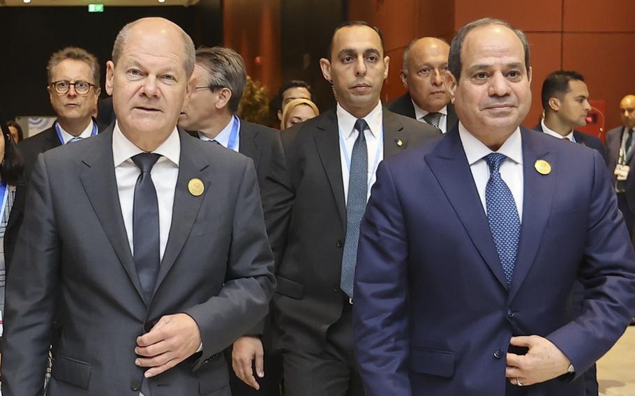 German Chancellor Olaf Scholz, left and Egyptian President Abdel Fattah el-Sisi walk to a meeting on Nov. 17, 2022, at the COP27 Climate summit held in Egypt.