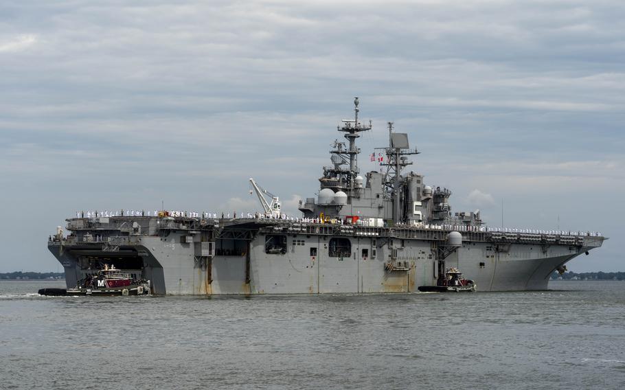 The amphibious assault ship USS Bataan (LHD 5) departs Naval Station Norfolk, Va., for a scheduled deployment Monday July 10, 2023. 