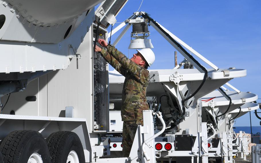 Air Force Senior Airman Payton Rogers, a 216th Electromagnetic Warfare Squadron systems operator, performs operational checks on the large multi-band antenna at Vandenberg Space Force Base, Calif., in November 2022.