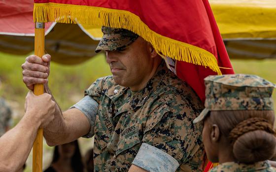 U.S. Marine Corps Lt. Col. Christopher O'Melia, right, the incoming commanding officer of 1st Battalion, 4th Marine Regiment, 1st Marine Division, receives the battalion’s colors from Lt. Col. George Flynn III, the outgoing commanding officer during a change of command ceremony at Marine Corps Base Camp Pendleton, California, June 8, 2023. The ceremony represented the transfer of command, from Flynn to O'Melia. (U.S. Marine Corps photo by Lance Cpl. Keegan Jones)