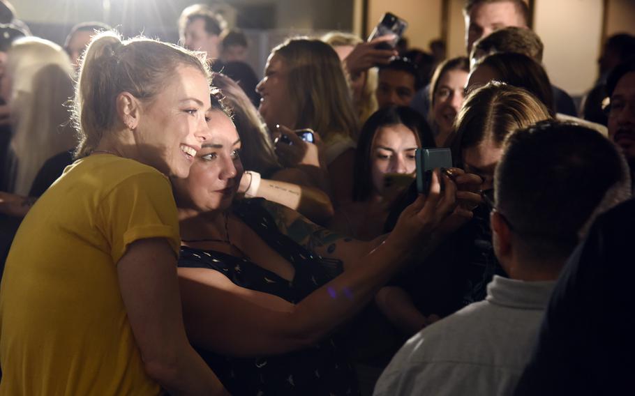 Comedian Iliza Shlesinger poses with a fan at Yokota Air Base's enlisted club in western Tokyo, Thursday, July 20, 2023.