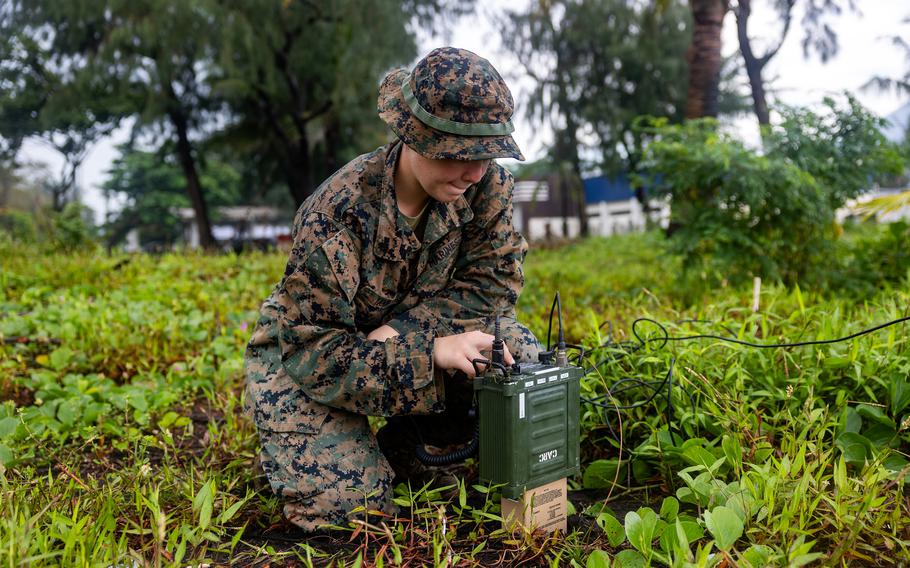 Cpl. Eniya Yanina of Marine Rotational Force-Southeast Asia uses a high frequency radio at Naval Station Julhasan Arasain in Legazpi, Philippines, Oct. 11, 2023.