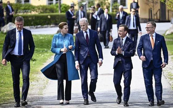 Sweden's Prime Minister Ulf Kristersson, second from right, welcomes the prime ministers of the Nordic countries, from left, Iceland's Bjarni Benediktsson, Denmark's Mette Frederiksen, Norway's Jonas Gahr Støre and Finland's Petteri Orpo, at Skeppsholmen in Stockholm, Sweden, Monday, May 13, 2024, ahead of a two-day Nordic Prime Minister's meeting, on security and competitiveness. (Pontus Lundahl/TT News Agency via AP)