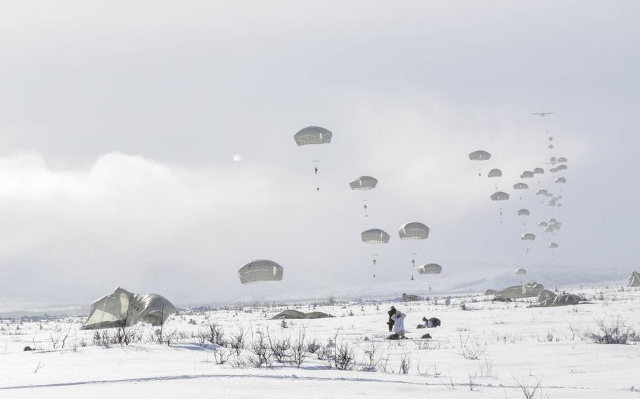 Paratroopers from the 1st Battalion, 501st Parachute Infantry Regiment, part of 4th Brigade, 25th Infantry Division assigned to U.S. Army Alaska, parachute onto Donnelly Drop Zone near Fort Greely, Alaska, March 11, 2022.