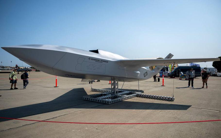 A model of a new aircraft on display outdoors.