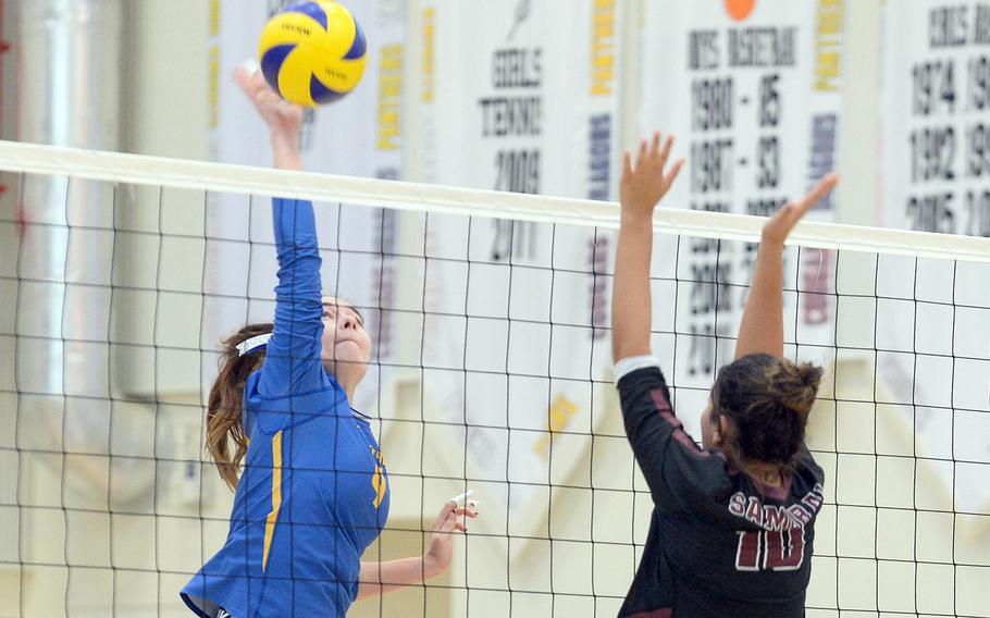 Yokota's McKayla Clouse spikes against Matthew C. Perry's Maddie Medina during Saturday's DODEA-Japan volleyball match. The Panthers won in four sets.