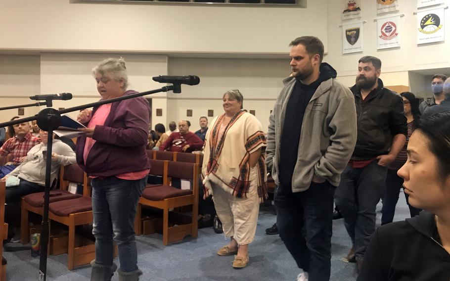 Hope Carter, the spouse of a Marine Corps Community Services employee, asks a question about changes to civilian health care during a town hall meeting at Marine Corps Air Station Iwakuni, Japan, Thursday, Jan. 12, 2023.