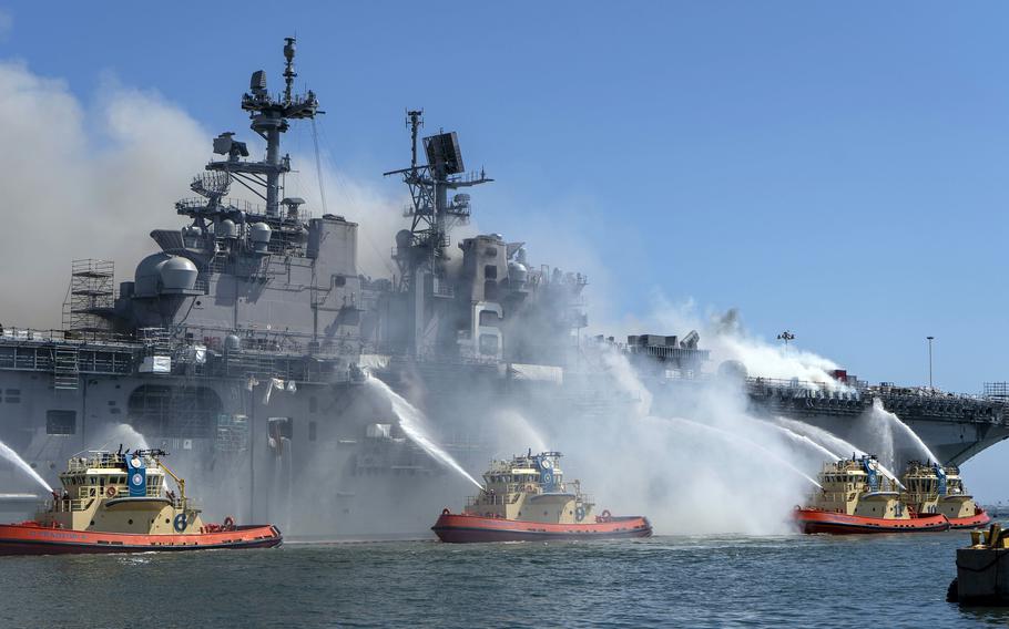 Sailors and firefighters combat a blaze aboard the USS Bonhomme Richard at Naval Base San Diego, July 12, 2020.