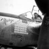 In this photo taken in March 1944 in the Pacific, Richard Bong, then a captain in the U.S. Army Air Force, sits in the cockpit of his P-38 fighter plane adorned with an image of his girlfriend, Marge, and a scoreboard tallying his 25 aerial victories over Japanese aircraft.
