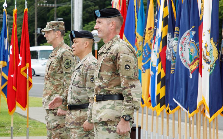 Brig. Gen. Joel Vowell, right, and Maj. Gen. Viet X. Luong, center, prepare for the start of their change-of-command ceremony at U.S. Army Japan headquarters on Camp Zama, Friday, June 25, 2021. U.S. Forces Japan commander Lt. Gen. Kevin Schneider stands at far left. 