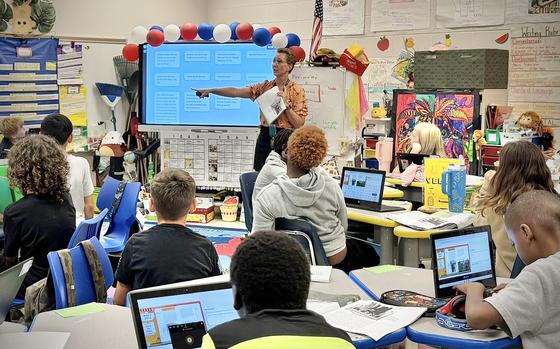 Dr. Lienne Hill engages her 5th grade students in an interactive lesson at Kessler Elementary School, Fort Stewart. With a dynamic classroom environment and technology at their fingertips, students actively participate in learning and critical thinking activities. DoDEA operates as a field activity of the Office of the Secretary of Defense. It is responsible for planning, directing, coordinating, and managing pre-kindergarten through 12th-grade educational programs for the Department of Defense. DoDEA operates 160 accredited schools in 8 districts in 11 foreign countries, seven states, Guam, and Puerto Rico. DoDEA Americas operates 50 accredited schools across two districts, located on 16 military installations, including Army, Navy, Marine Corps, Air Force, and Coast Guard bases in seven states, Puerto Rico, and Cuba. Committed to excellence in education, DoDEA fosters well-rounded, lifelong learners, equipping them to succeed in a dynamic world.