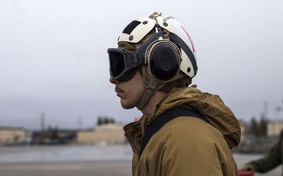 Lance Cpl. Dominic Youngren, a mechanic with Marine Fighter Attack Squadron 242, stands by to send off an F-35B Lightning II stealth fighter at Eielson Air Force Base, Alaska, May 12, 2022.