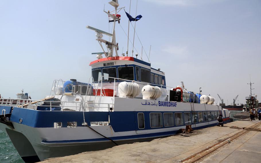 A picture taken on June 2, 2018, in Yemen’s rebel-held Red Sea port of Hodeida shows a ship flying the flags of Yemen and the International Organization for Migration moored to the dock as it awaits incoming Ethiopian migrants who are being repatriated via Djibouti.