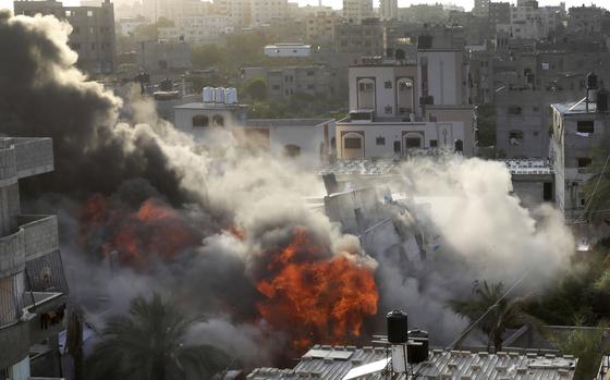 Smoke and fire rise from an explosion caused by an Israeli airstrike targeting a building in Gaza, Saturday, May 13, 2023. The building was owned by an Islamic Jihad official. (AP Photo/Ashraf Amra)