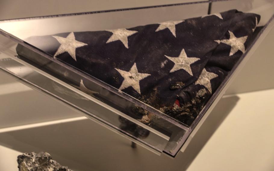 This partially-burned flag with bits of aluminum melted into it, recovered from the Pentagon after the 9/11 attack, is on display at the National Museum of the United States Army.