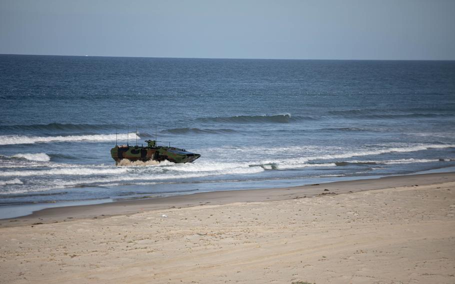 A U.S. Marine Corps amphibious combat vehicle (ACV) with 3d Assault Amphibian Battalion, 1st Marine Division, lands on the shore during a training evolution at Marine Corps Base Camp Pendleton, Calif., March 13, 2022.ine Corps photo by 2nd Lt. Joshua Estrada)