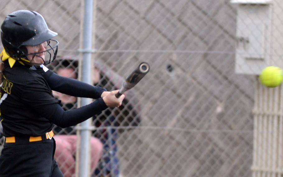 Kadena's Emaleigh Appleton belts a single against Kubasaki during Tuesday's DODEA-Okinawa softball game. The Panthers won 4-1 and took a 3-0 season-series lead over the Dragons.