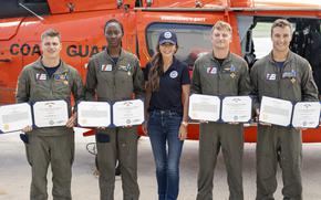 Secretary Kristi Noem presents medals to Lieutenant Ian Hopper, Lieutenant Blair Oguiofor, Petty Officer 3rd Class Scott Ruskan, and Petty Officer 3rd Class Seth Reece of Air Station Corpus Christi during a ceremony on July 11, 2025. The medals recognize their roles in the Camp Mystic rescue on July 4, when Coast Guard crews evacuated dozens of campers and staff amid flash flooding at the Guadalupe River.
(U.S. Coast Guard photo by Petty Officer 3rd Class Perry Shirzad/Released)