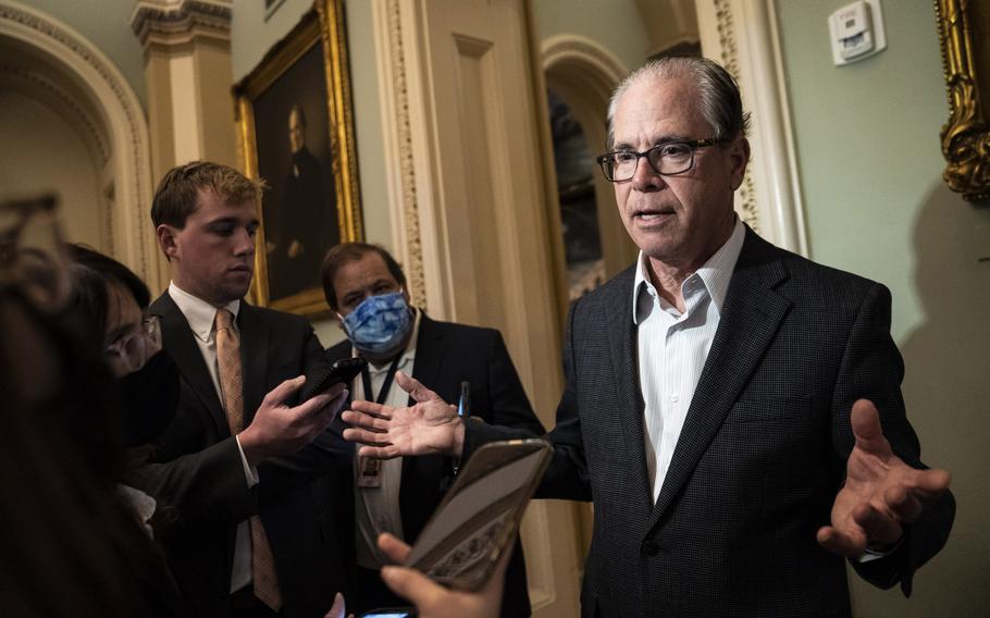 Sen. Mike Braun, R-Ind., speaks to reporters on Capitol Hill on Dec. 1.