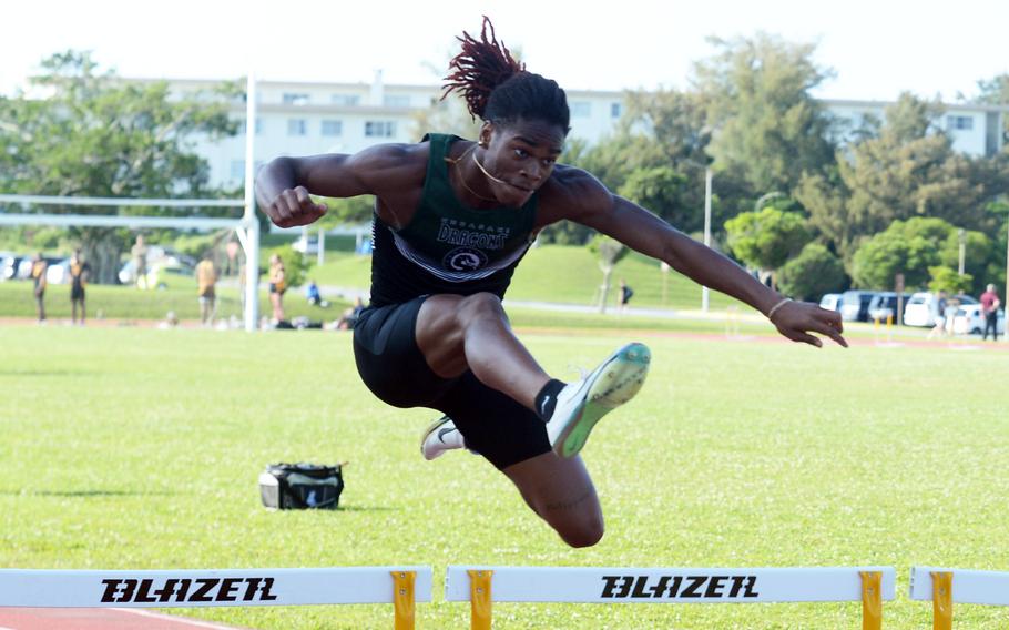 Calros Cadet clears a hurdle.