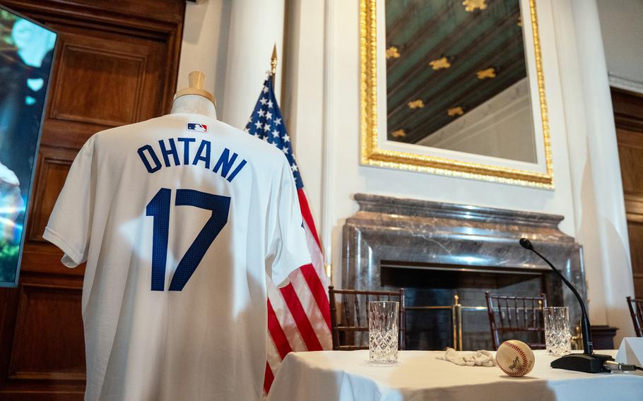 Major League Baseball memorabilia, including a jersey Shohei Ohtani wore during his first games with the Los Angeles Dodgers, sits on display at the U.S. ambassador's in Tokyo, April 18, 2024.