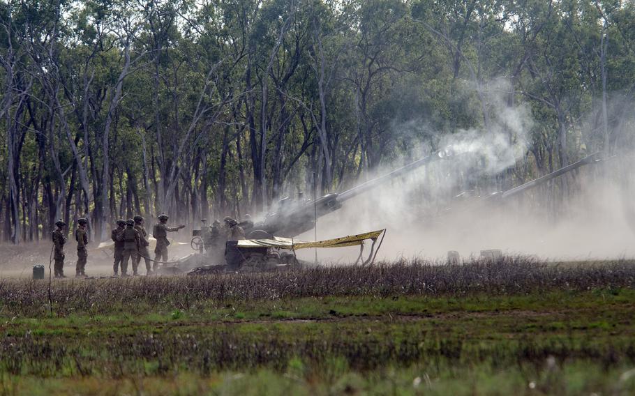 Australian soldiers fire a lightweight howitzer, the M-777A2, during a Talisman Sabre drill at the Shoalwater Bay Training Area in Queensland, Australia, Saturday, July 22, 2023.