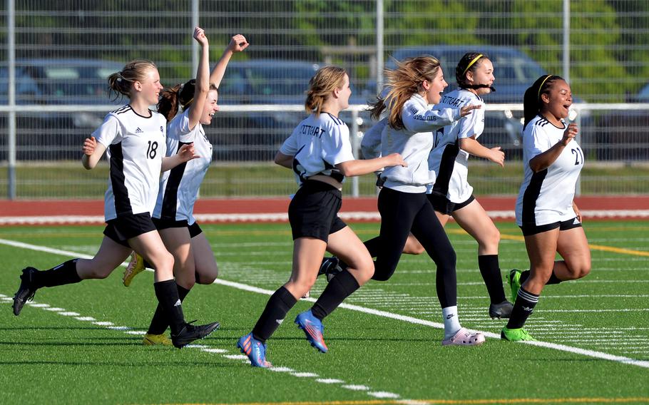 Stuttgart players rush the field after the final whistle in the girls Division I final at the DODEA-Europe soccer championships in Ramstein, Germany, May 18, 2023. Stuttgart beat Lakenheath 1-0 to win the title