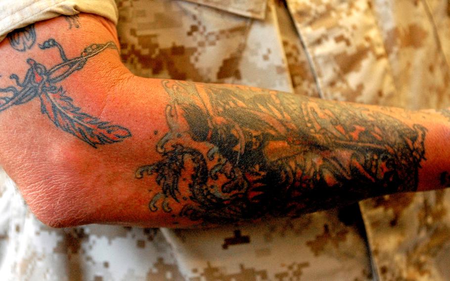 Tattoos on a Marine Corps Base Quantico, Va.-based Marine in 2008. While sleeve tattoos remain prohibited under current regulations, the Corps has ended a rule requiring its members to submit 360-degree photos of themselves when seeking enlisted retention, or special assignments such as embassy guard or drill instructor duty.