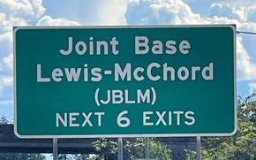Sign on Interstate 5 for exits to Joint Base Lewis-McChord, south of Tacoma, Wash.