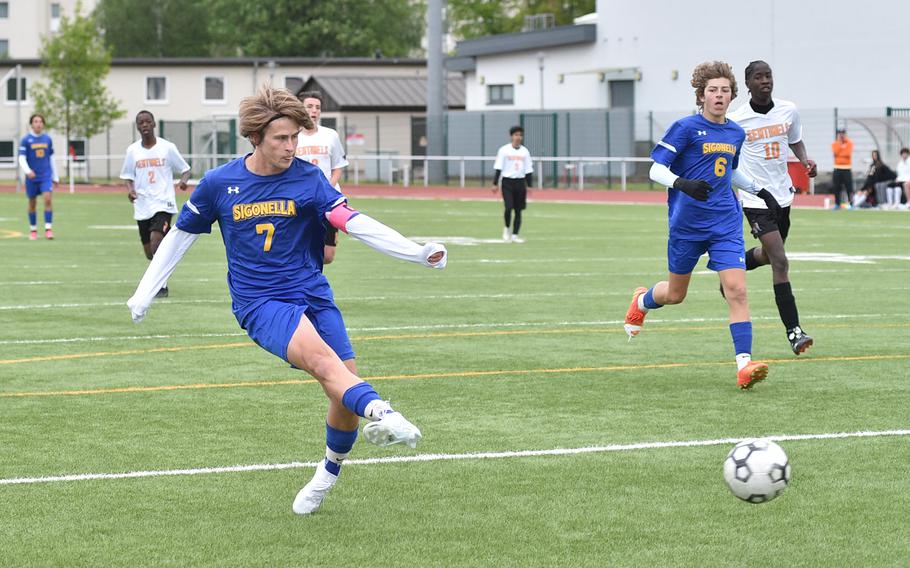 Sigonella captain Tim Garcia shoots during Division III pool-play action against Spangdahlem on May 16, 2023, at Kaiserslautern High School in Kaiserslautern, Germany. At right are Jaguar teammate Mikolaj Czernielewski and Sentinel defender Darrian Kelly.