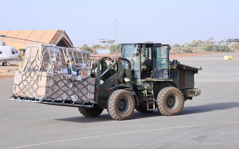 Senior Airman Bailey Malik transports cargo at Air Base 101, Niger, in November 2022. U.S. personnel and equipment are being repositioned following a coup in Niger that has brought a halt to U.S. military operations in the country.  